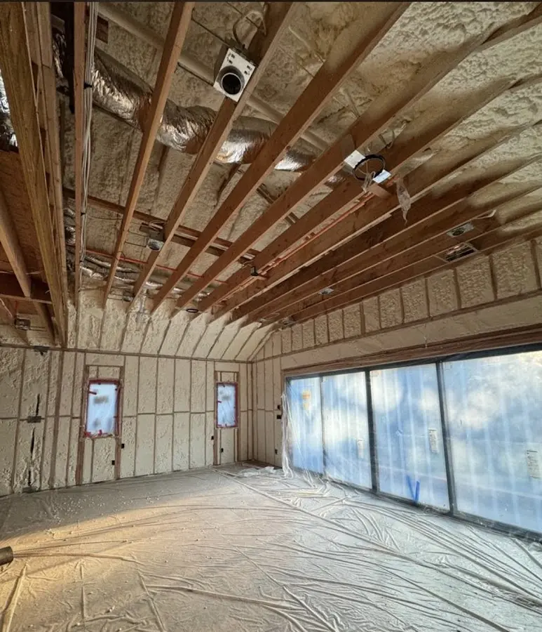 Interior walls and ceiling insulated with spray foam during new construction in Radford